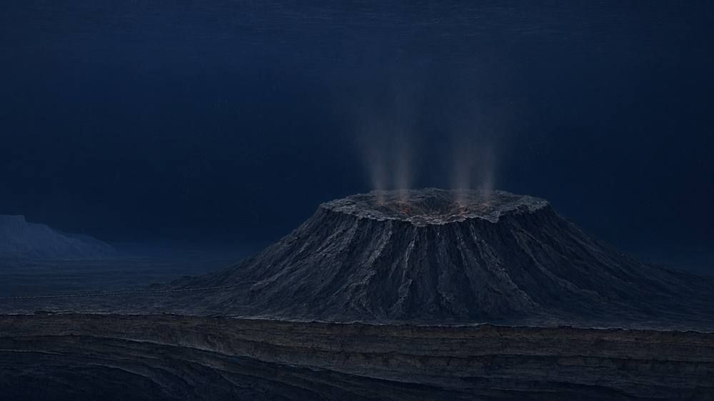 A dark, broad volcano with a crater-like summit and thin plumes of warm water rising into deep blue water, a cable running along the seafloor, and a faint slope in the far distance.